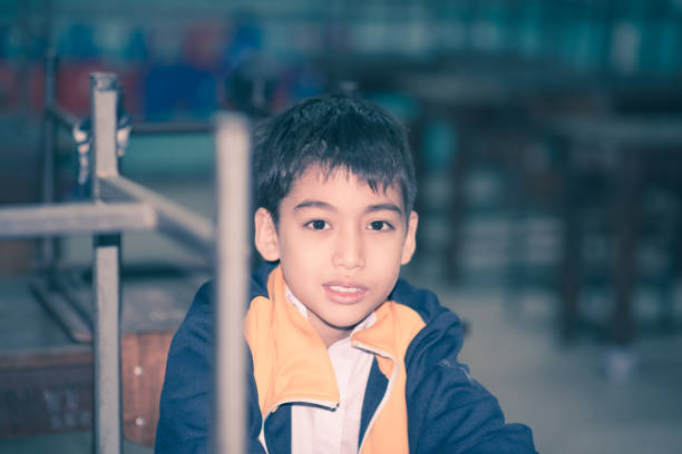 istock Little boy using Dust Respirator Folding Protection Mask PM2.5 at school 1147477779