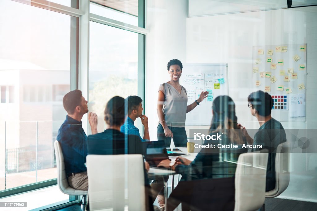 Growth creates more growth Shot of a group of businesspeople having a meeting in a modern office Meeting Stock Photo