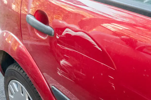 Photo of Scratches on the red car