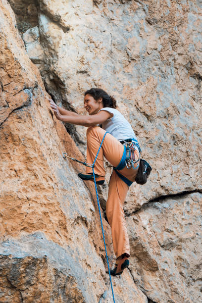 istock Woman climbs mountain. 1147480042