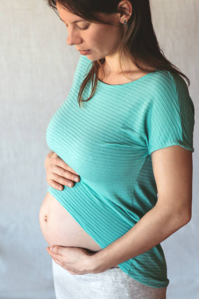 istock Pregnan woman cropped portrait. 1147480071