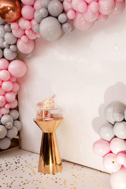 istock Delicious wedding reception. Birthday Cake on a background balloons party decor. Copy space. Celebration concept. Trendy Cake. Candy bar. Table with sweets, dessert 1147480165