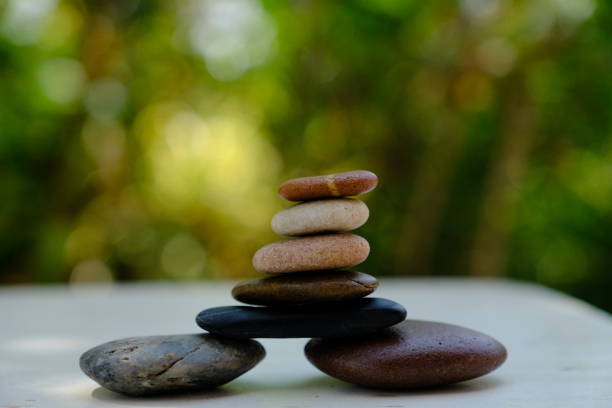 maintaining the balance of zen stone - aspirations pebble balance stack imagens e fotografias de stock