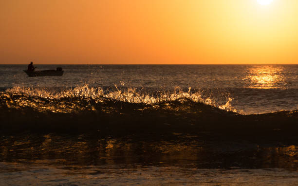 Sunset waves at the tip of Borneo stock photo