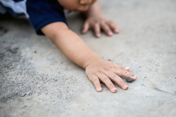 istock Asian children playing outside with dirty hands 1147485986
