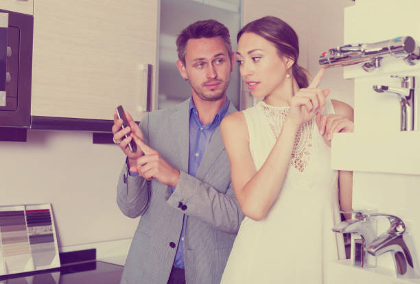 istock Couple choosing new mixer tap 1147490152