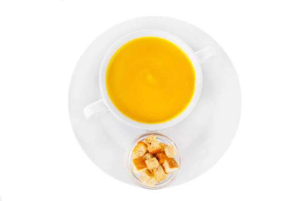 istock Soup in a white plate isolated white 1147491163