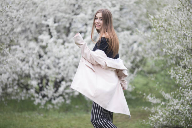 istock A young woman has relax among the blossoming cherry trees. 1147494440