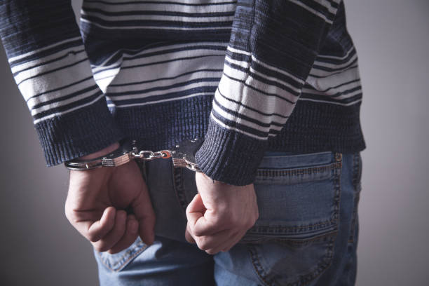 istock Man in handcuffs. Criminal concept 1147495785