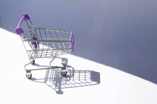istock Mini shopping car with hard lighting and its shadow. 1147496020