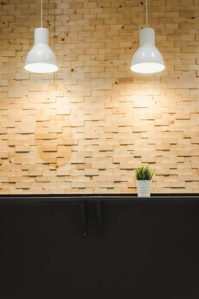 istock Modern Architecture and Interior Decoration With Lights Bulb on Wooden Wall Background, Home Decorative and Styles Concept 1147500501