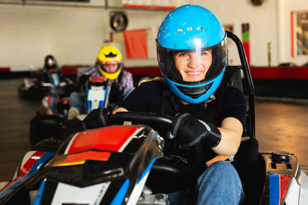 istock Female driving go-kart car indoor 1147500520