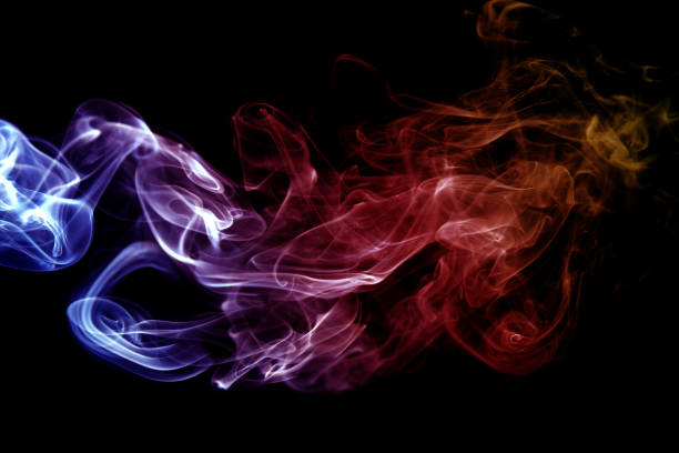istock Close-Up Of Multi Colored Smoke Against Black Background 1147500667