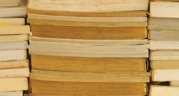 istock Full Frame Shot Of Stacked Books In Library 1147501080