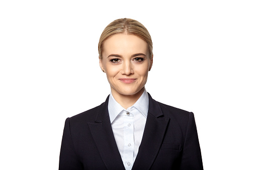 Portrait of smiling blonde in business outfit. Studio shot isolated on white background.