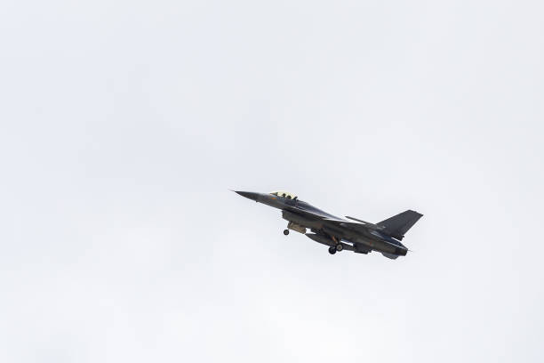 istock Low Angle View Of Fighter Plane Flying In Sky 1147502169
