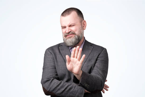 istock Handsome mature man with beard making stop sign 1147505314