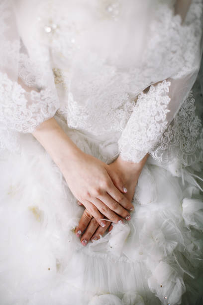 istock Bride dressed in white wedding gown waiting for bridegroom 1147505636