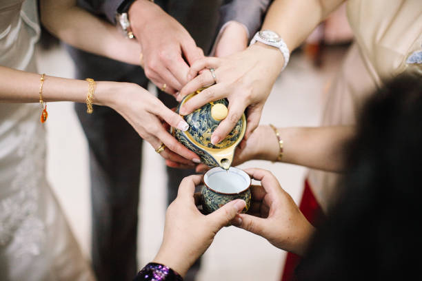 istock Newlywed serving tea to elder on Chinese traditional tea ceremony 1147506287