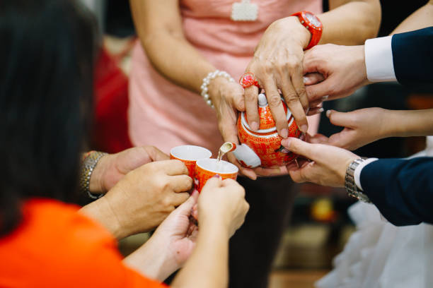 istock Newlywed serving tea to elder on Chinese traditional tea ceremony 1147506353