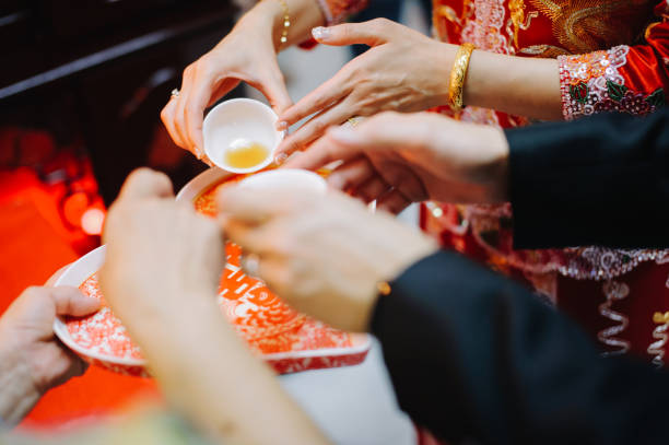 istock Newlywed serving tea to elder on Chinese traditional tea ceremony 1147506438
