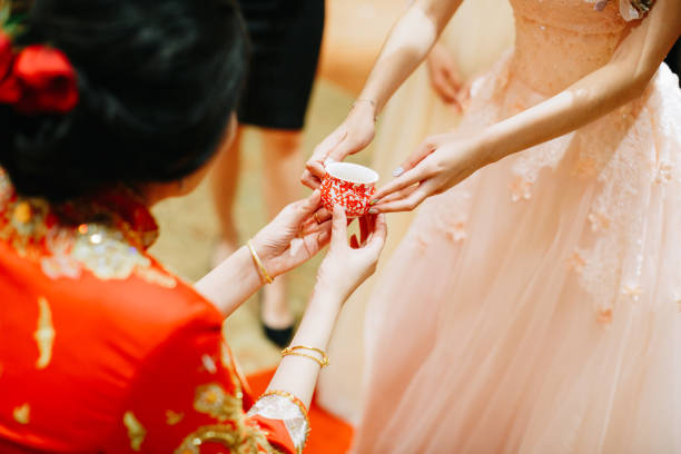 istock Sibling serving tea to bride on Chinese traditional tea ceremony 1147506499
