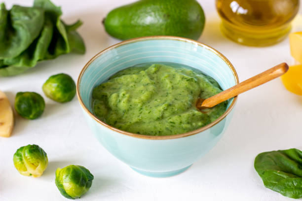 istock Cream soup with avocado, spinach and cheese. Healthy eating. White background 1147506881