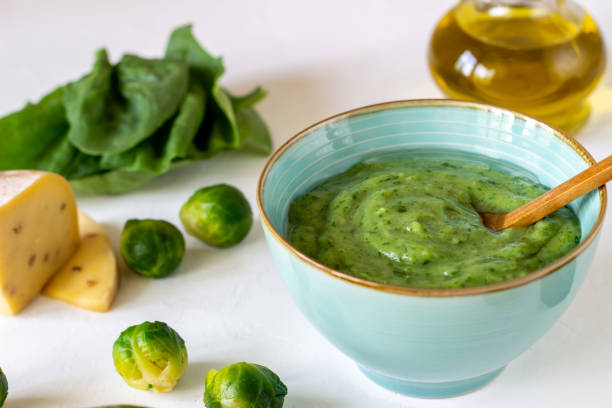 istock Cream soup with avocado, spinach and cheese. Healthy eating. White background 1147506892