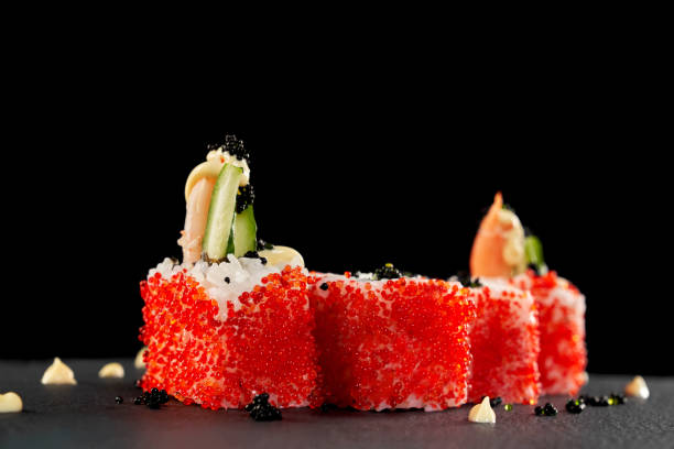 istock Uramaki sushi with sauce and caviar. 1147507056