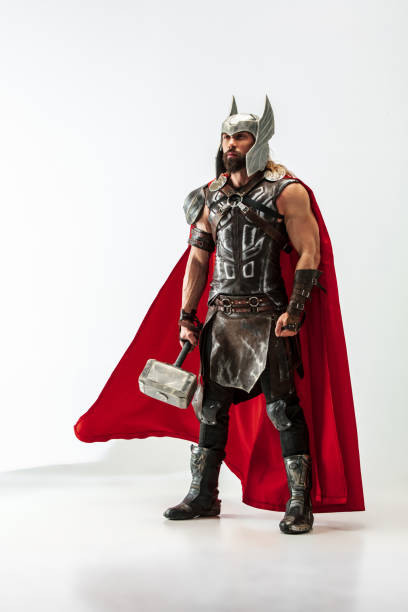 istock Man in cosplaying Thor isolated on white studio background 1147508538