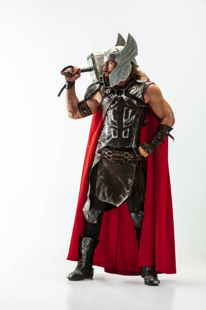 istock Man in cosplaying Thor isolated on white studio background 1147508544