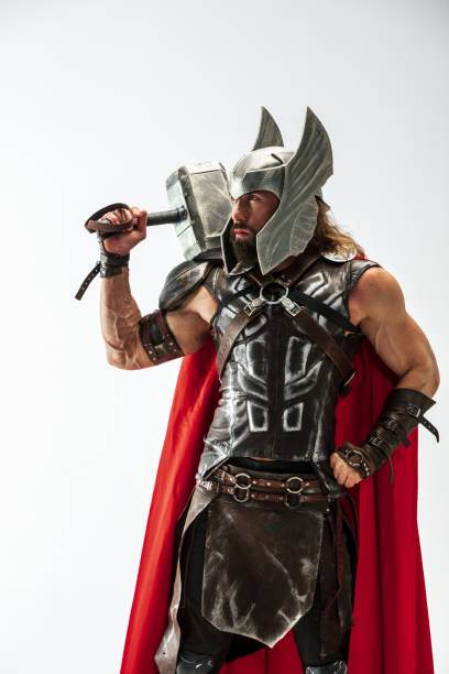 istock Man in cosplaying Thor isolated on white studio background 1147508553