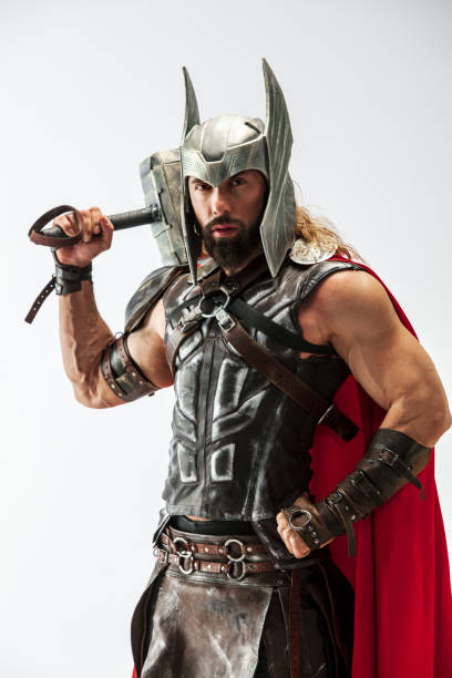 istock Man in cosplaying Thor isolated on white studio background 1147508561