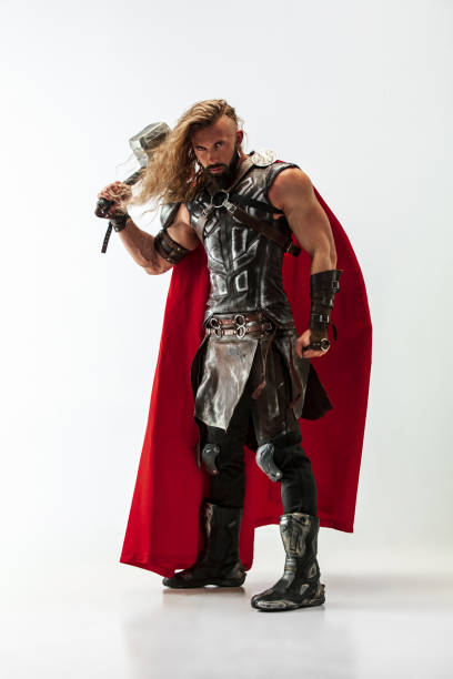istock Man in cosplaying Thor isolated on white studio background 1147508570