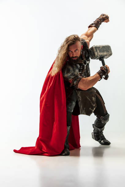 istock Man in cosplaying Thor isolated on white studio background 1147508574