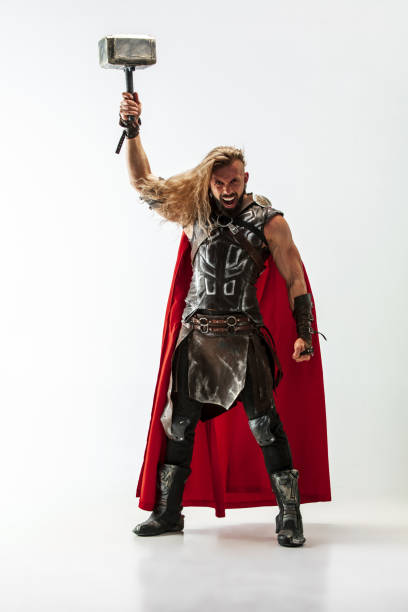 istock Man in cosplaying Thor isolated on white studio background 1147508592