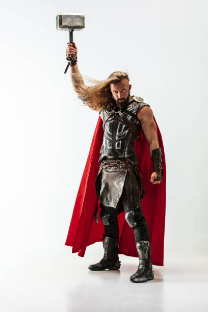 istock Man in cosplaying Thor isolated on white studio background 1147508594