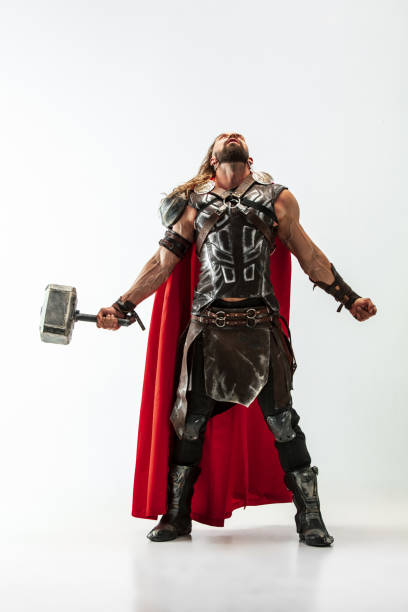 istock Man in cosplaying Thor isolated on white studio background 1147508600