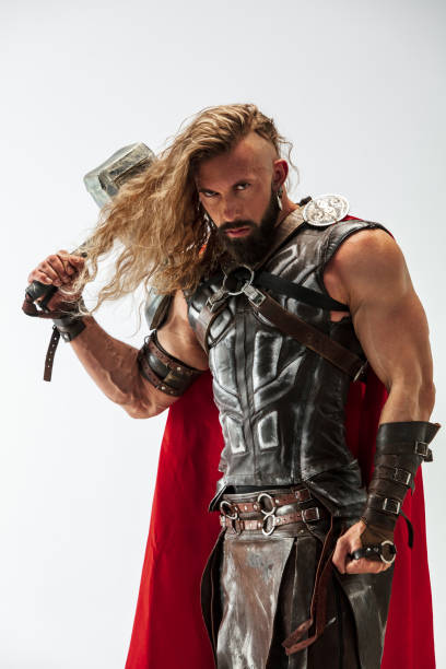 istock Man in cosplaying Thor isolated on white studio background 1147508610