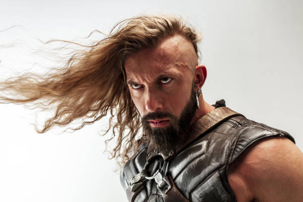 istock Man in cosplaying Thor isolated on white studio background 1147508614