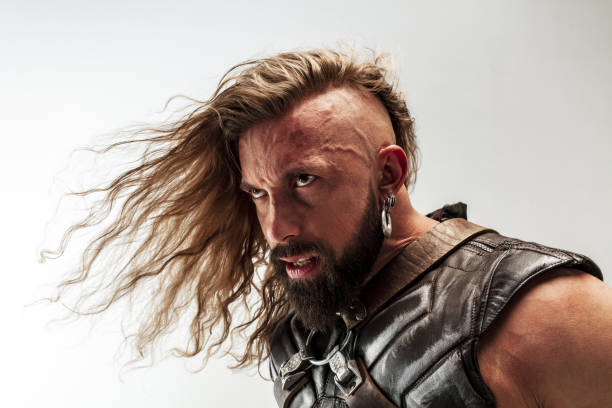 istock Man in cosplaying Thor isolated on white studio background 1147508648