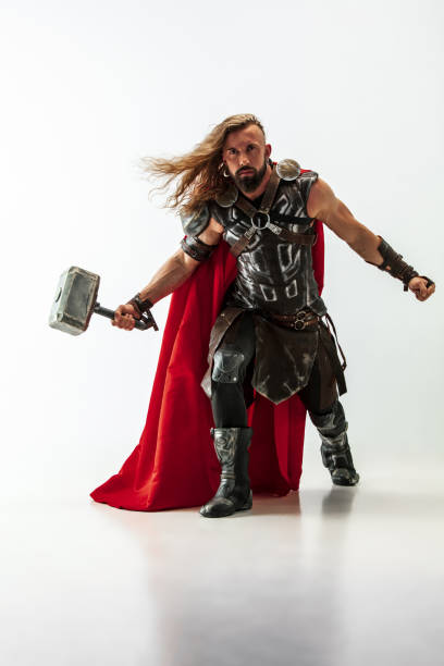 istock Man in cosplaying Thor isolated on white studio background 1147508651