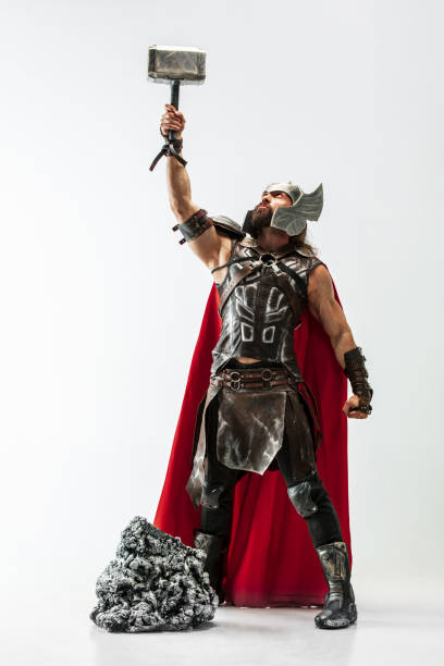 istock Man in cosplaying Thor isolated on white studio background 1147508683