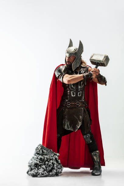 istock Man in cosplaying Thor isolated on white studio background 1147508699