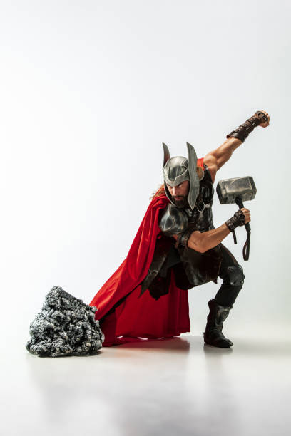 man in cosplaying thor isolated on white studio background - cosplay imagens e fotografias de stock