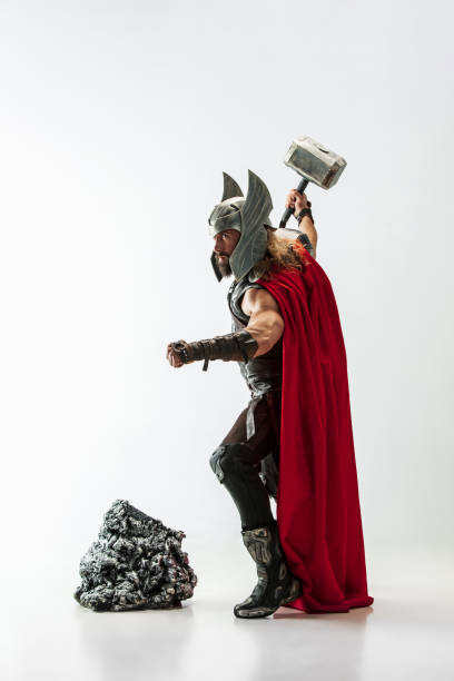 istock Man in cosplaying Thor isolated on white studio background 1147508705