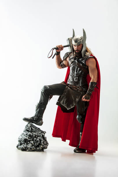 istock Man in cosplaying Thor isolated on white studio background 1147508711
