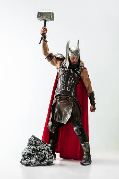 istock Man in cosplaying Thor isolated on white studio background 1147508714