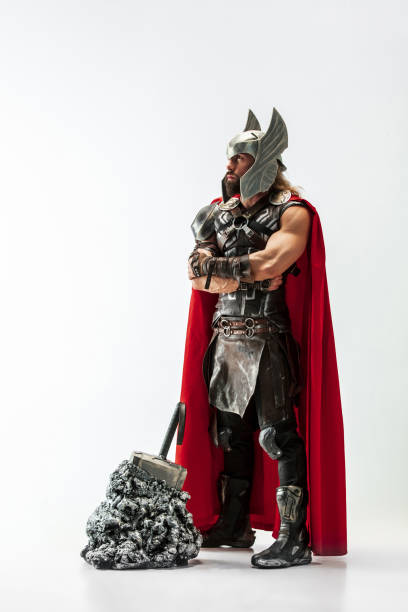 istock Man in cosplaying Thor isolated on white studio background 1147508725