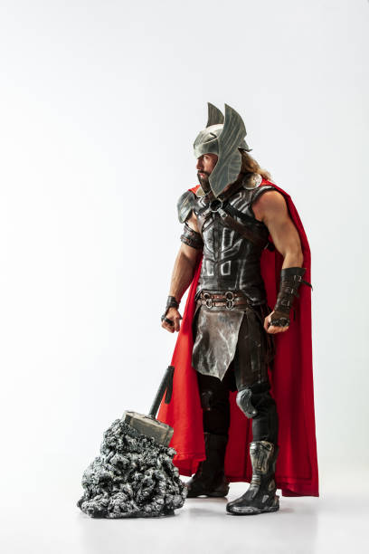 istock Man in cosplaying Thor isolated on white studio background 1147508726